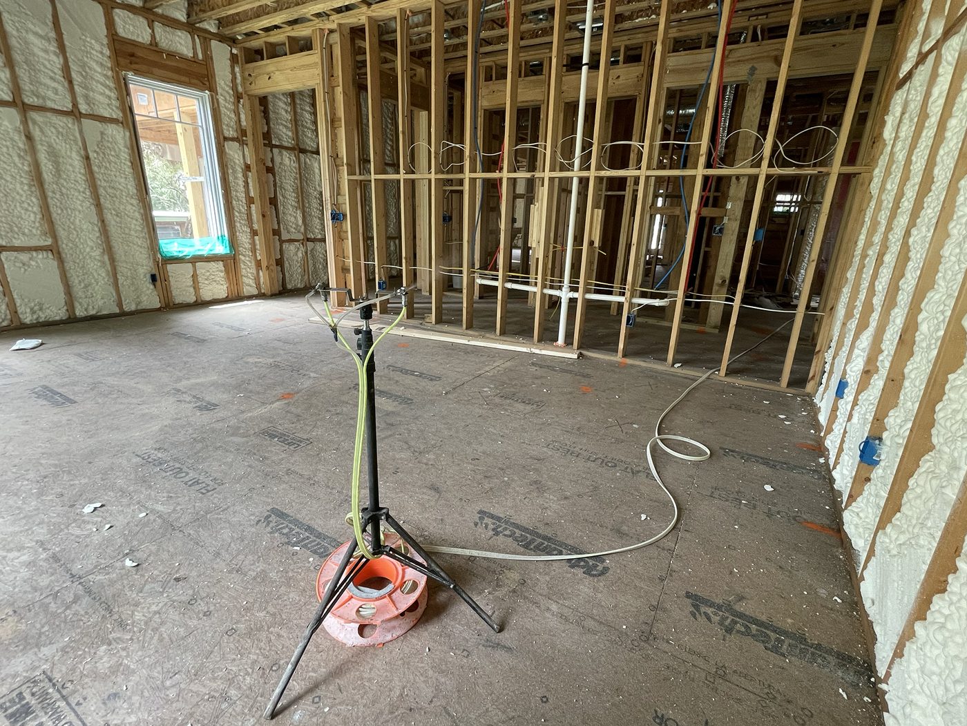 AeroBarrier sealing rig set up at framing stage in an Okanagan home, pre-drywall