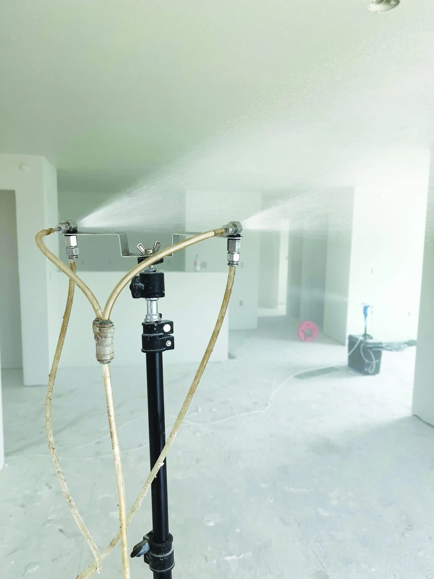 AeroBarrier aerosol mist filling a room from the sealing station during a seal